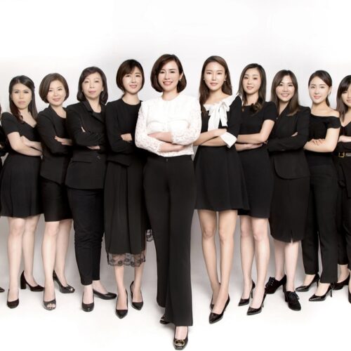 A group of corporate professionals in a business setting.