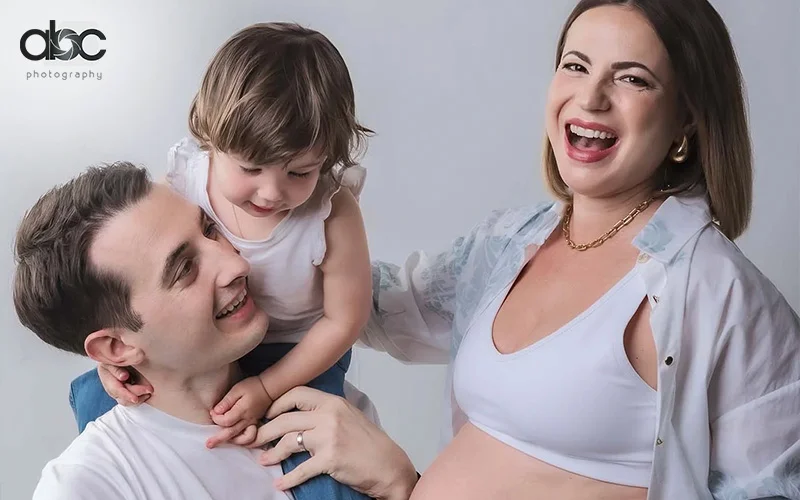 Casual family photoshoot with everyone dressed in white shirts