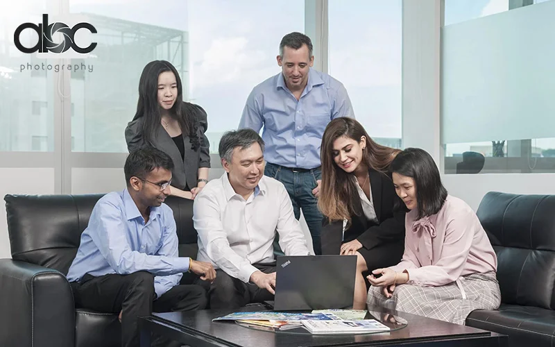 Employees arranging a corporate photoshoot