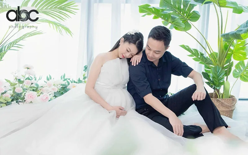 Asian Couple posing for pregnancy photoshoot