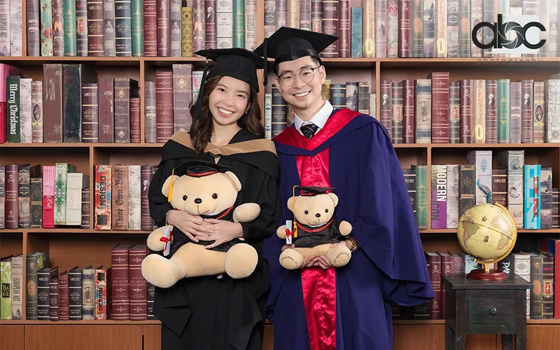 Couple taking graduation shoot