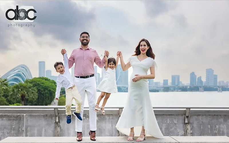 Indian Family posing for outdoor pregnancy photoshoot