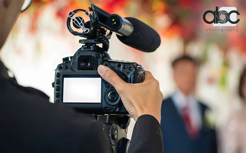A cameraman capturing wedding moments