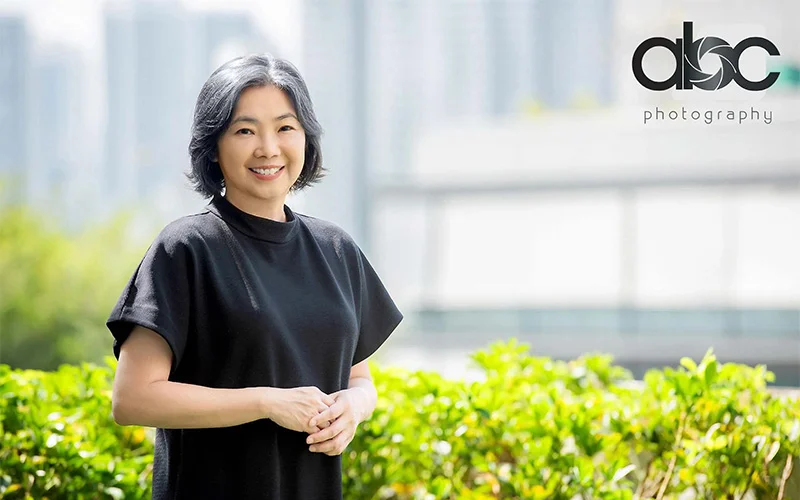Asian woman posing for a portrait photo outdoors