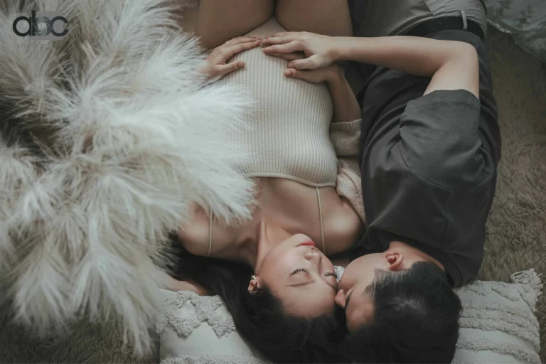 Couple maternity photoshoot on fur rug