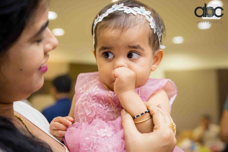 Birthday girl with mother at party
