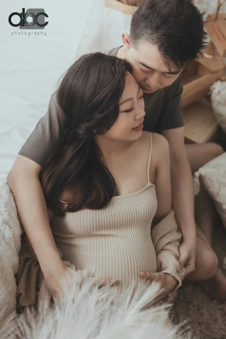 Couple maternity studio photoshoot in cream