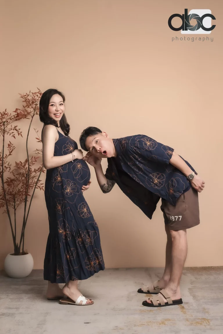 Playful couple pregnancy photoshoot