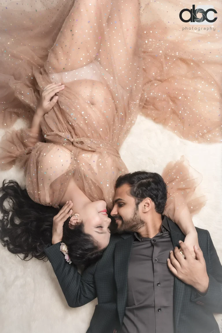 Couple lying down during maternity photoshoot Singapore