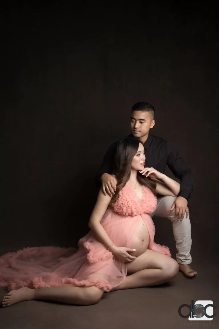 Couple maternity photoshoot with pink gown