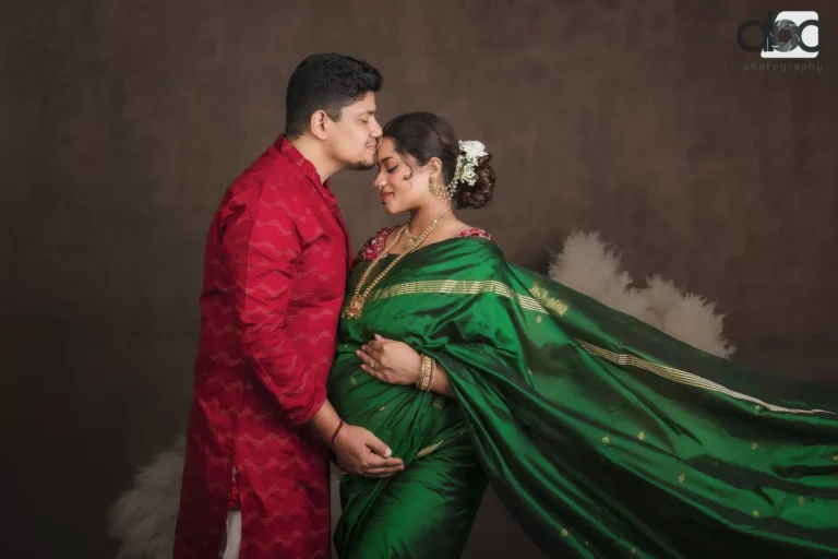 Couple maternity photoshoot in green saree