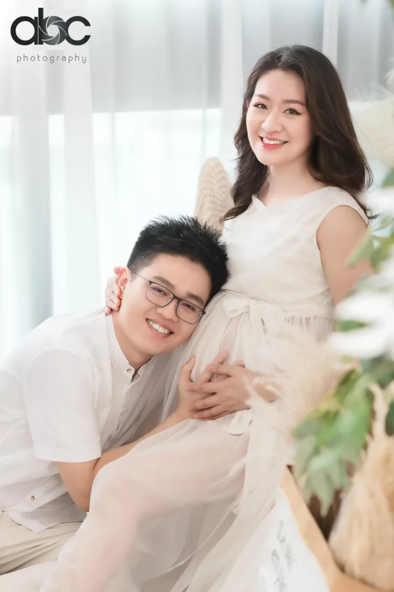Couple pregnancy portrait in cream outfits