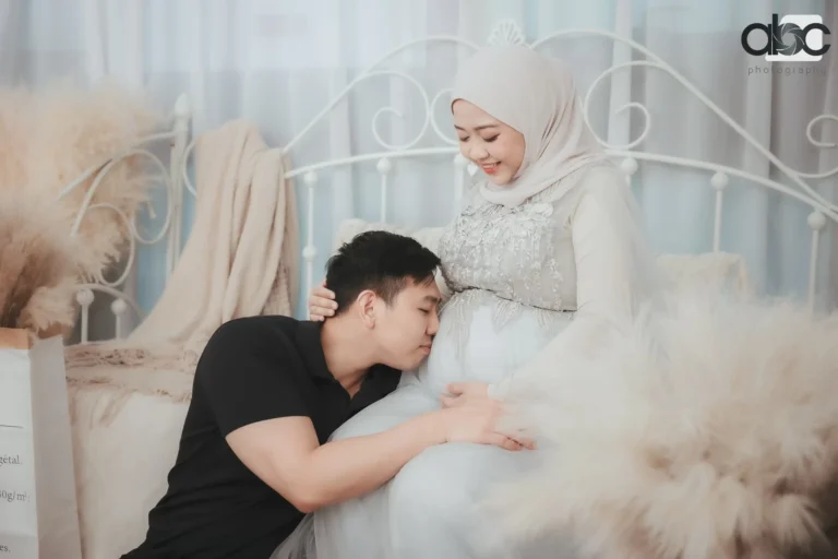 Couple maternity photoshoot with white gown