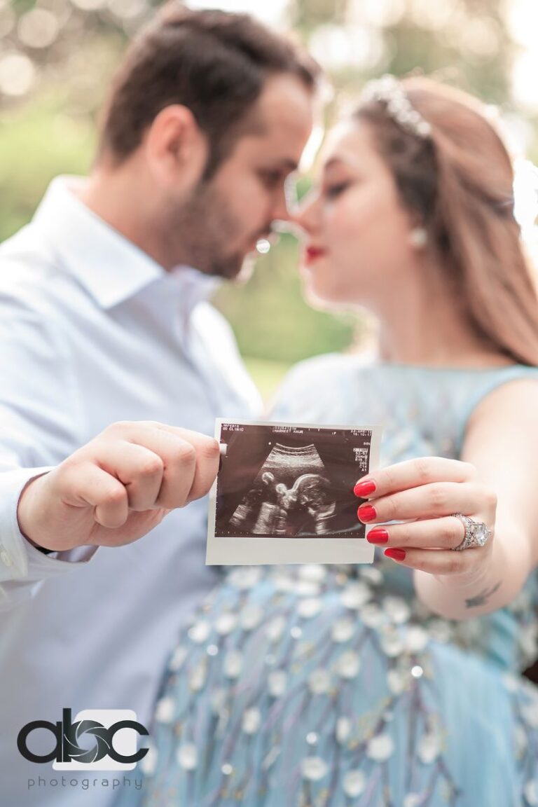 Couple with ultrasound photo pregnancy photoshoot