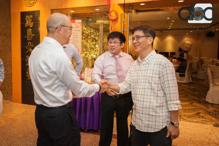 Guests shaking hands at corporate event