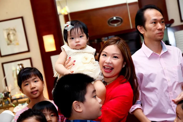 Family celebrating baby's birthday party event