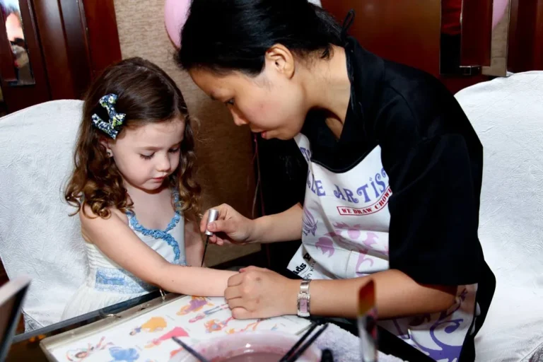 Child enjoying craft activity at party
