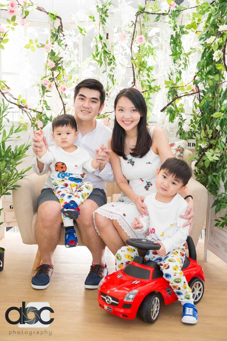 Family studio photoshoot with toy car