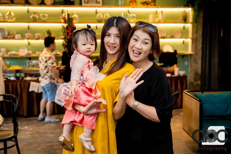 Mother and baby girl at event ceremony
