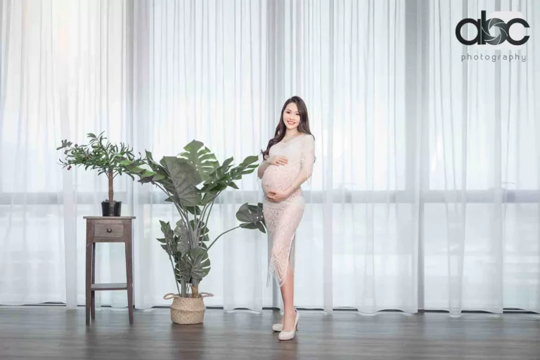 Maternity photoshoot studio with bright curtains