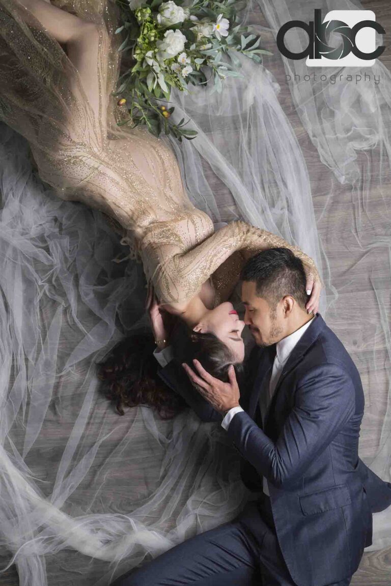 Couple pregnancy photoshoot with sheer fabric