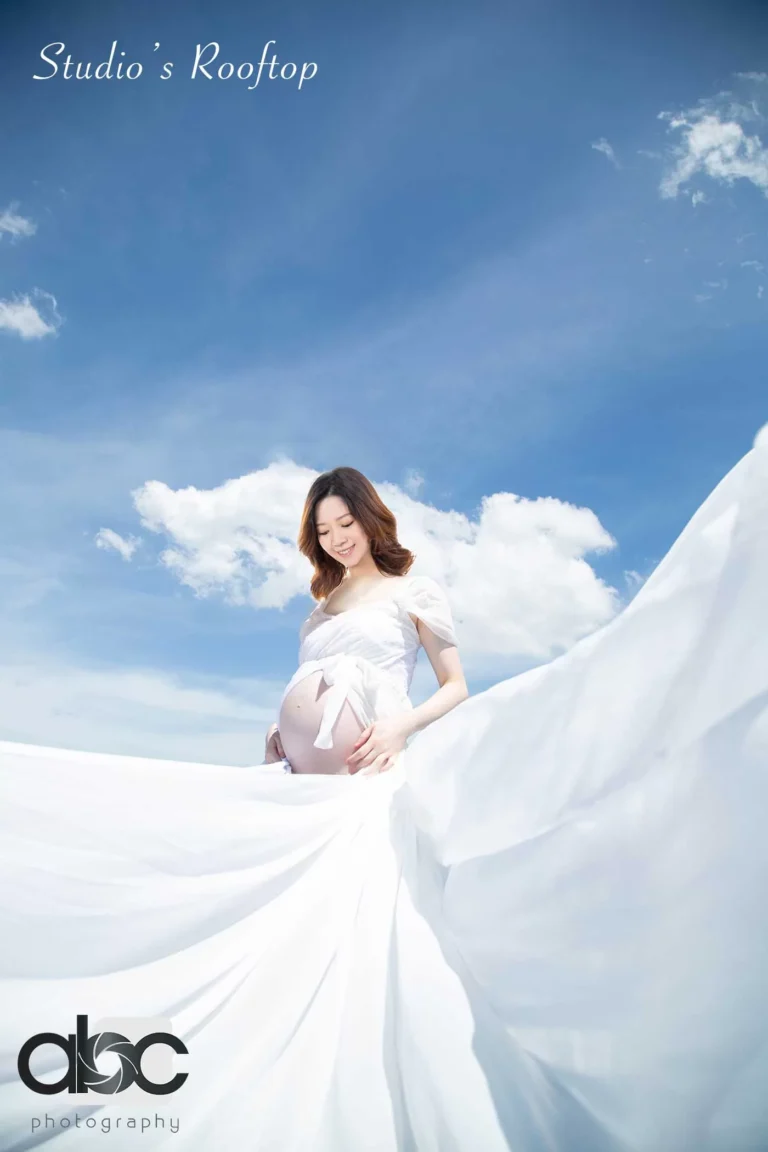 Rooftop maternity photoshoot with white gown Singapore