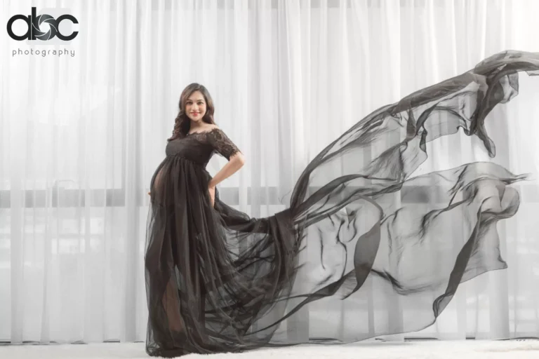 Maternity portrait with flowing black gown