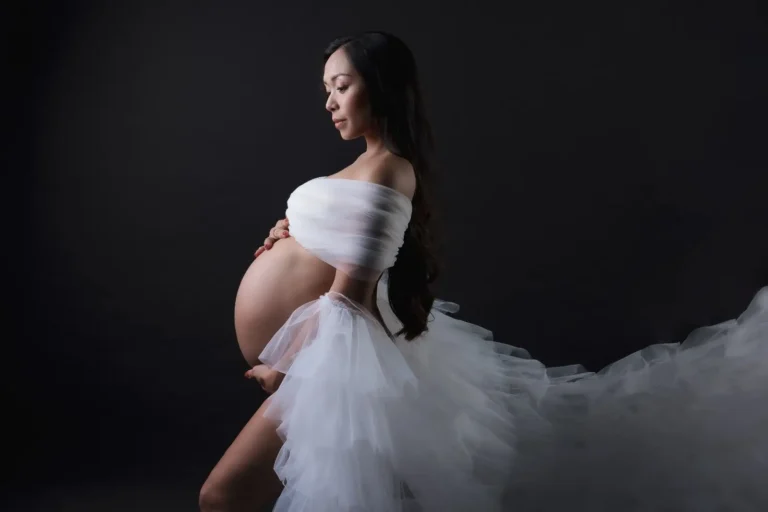 Dramatic maternity portrait with tulle skirt