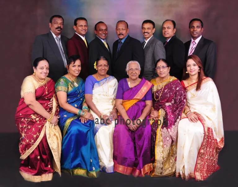 Extended family portrait in saris