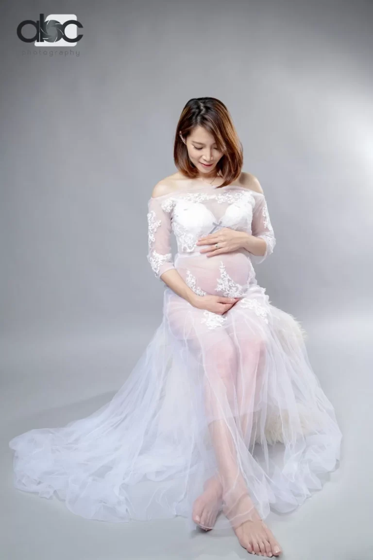 Maternity portrait in white tulle gown