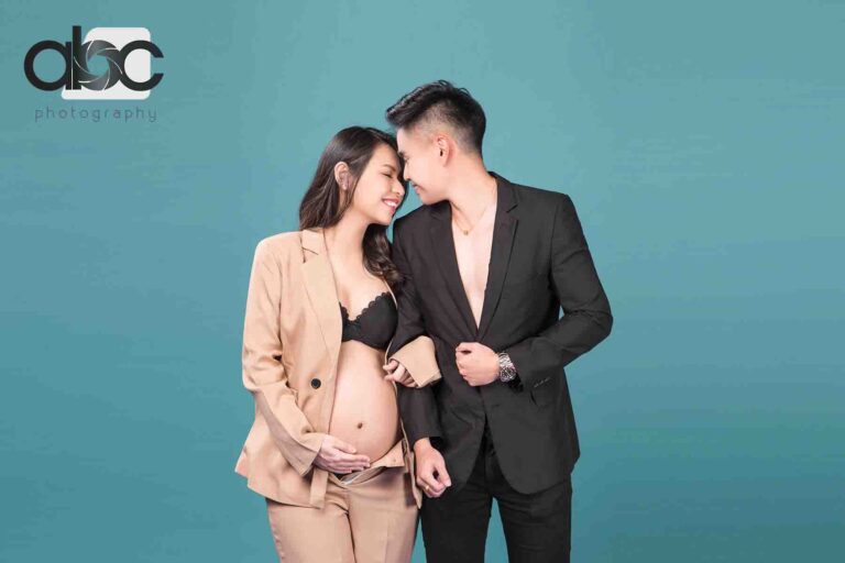 Couple maternity photoshoot in business suits