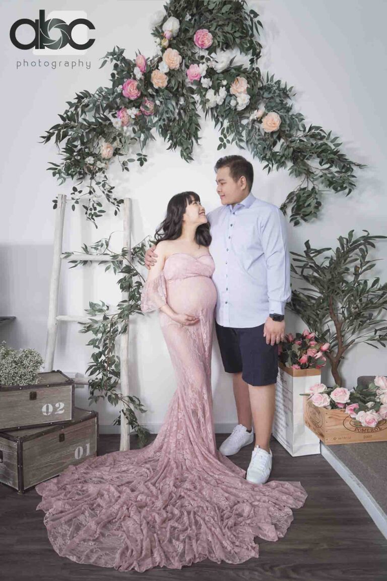 Couple maternity photoshoot Singapore floral arch