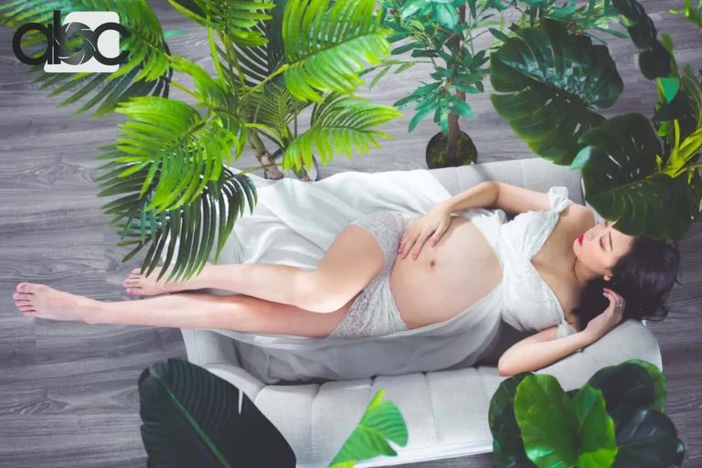 Maternity photoshoot with tropical leaves