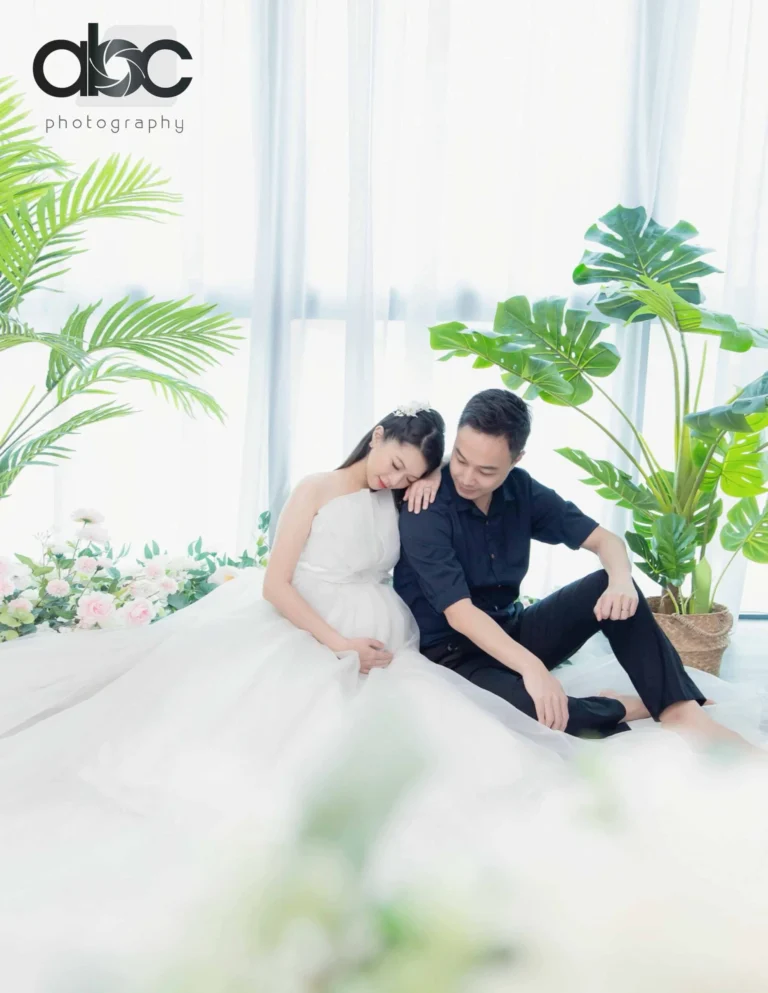 Couple maternity photoshoot in bright studio Singapore