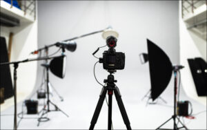 Camera on tripod setups portrait photography composition in studio.