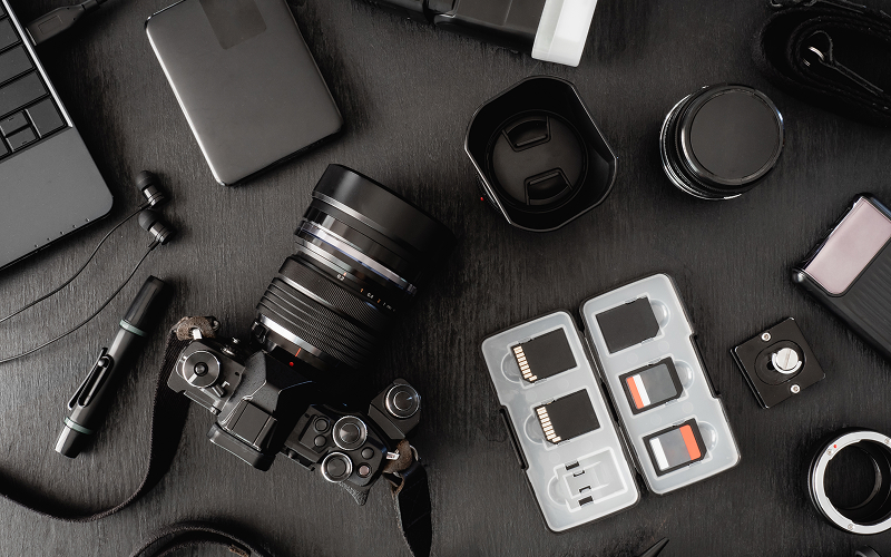 Flat lay of portrait photography composition gear and lenses.